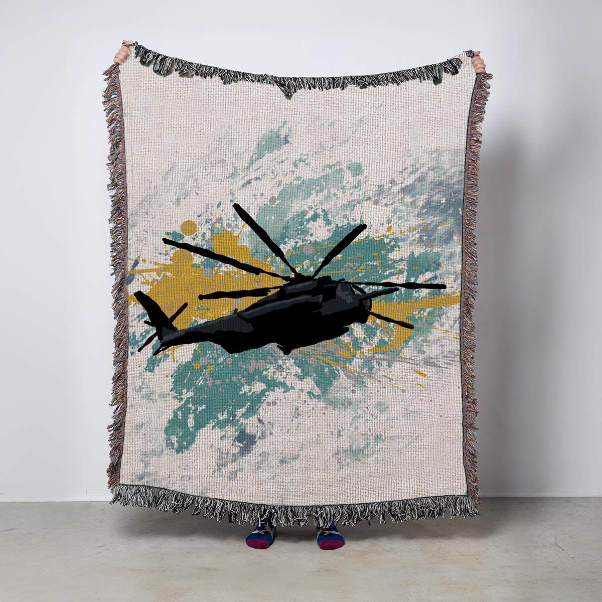 Blanket with helicopter design on a textured background