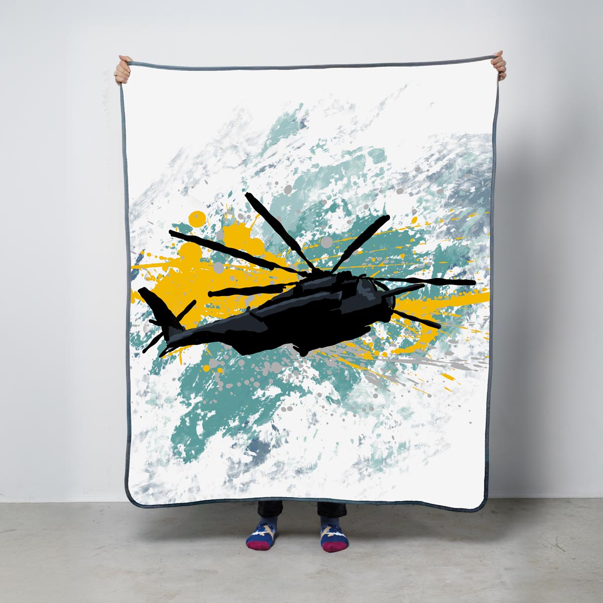 Fleece blanket with a helicopter design on a white background