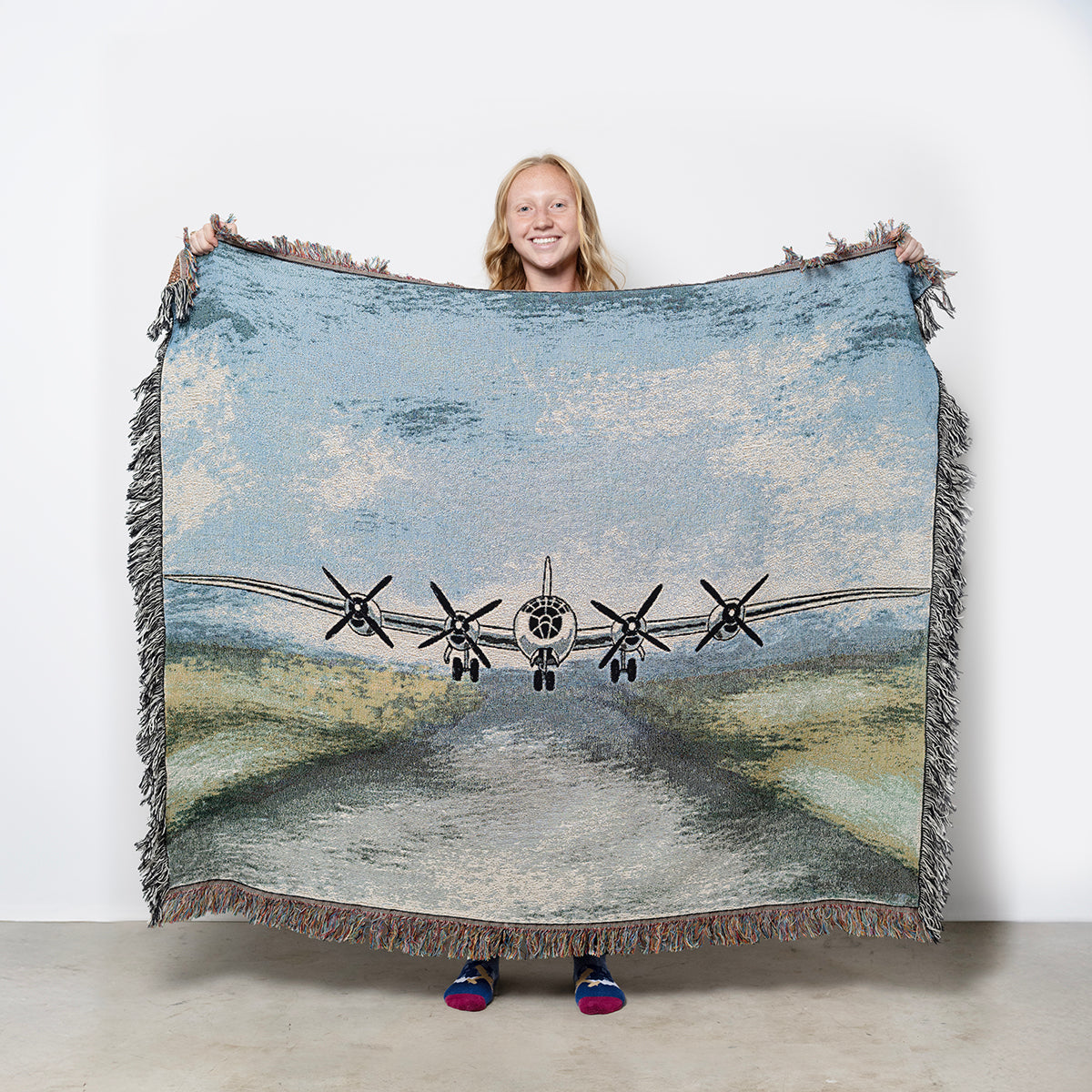 Woven blanket with Boeing B-29 Superfortress airplane design