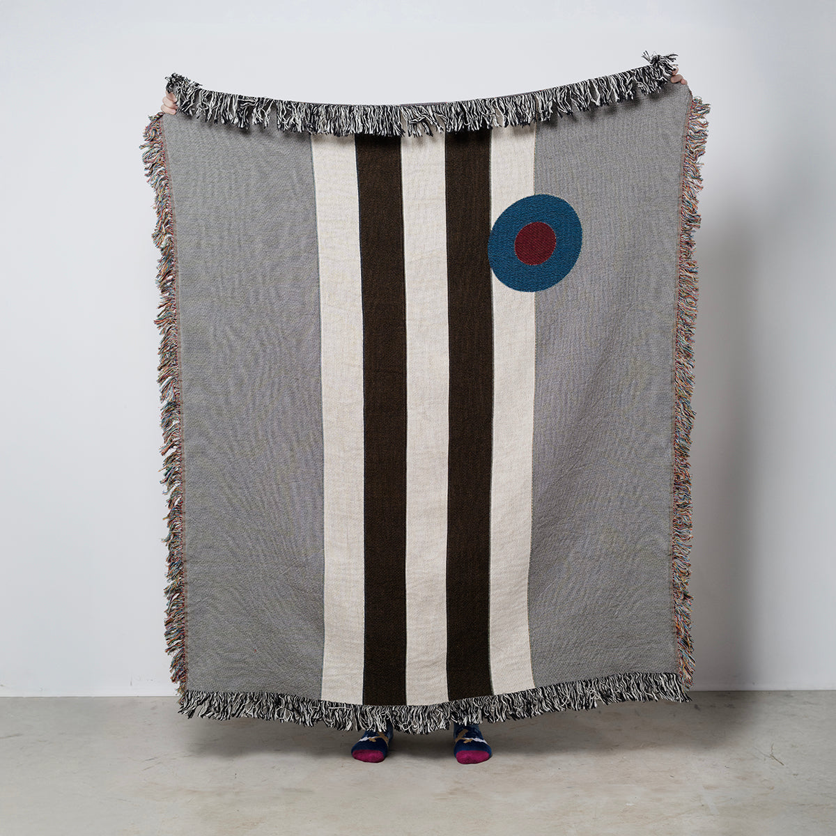 Woven blanket with geometric design and invasion stripes