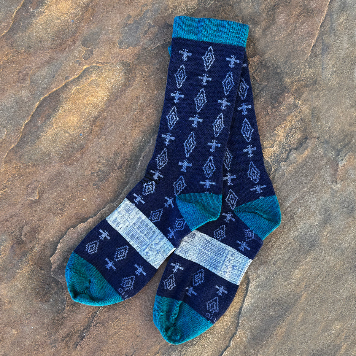 Pair of navy blue socks with airplane pattern