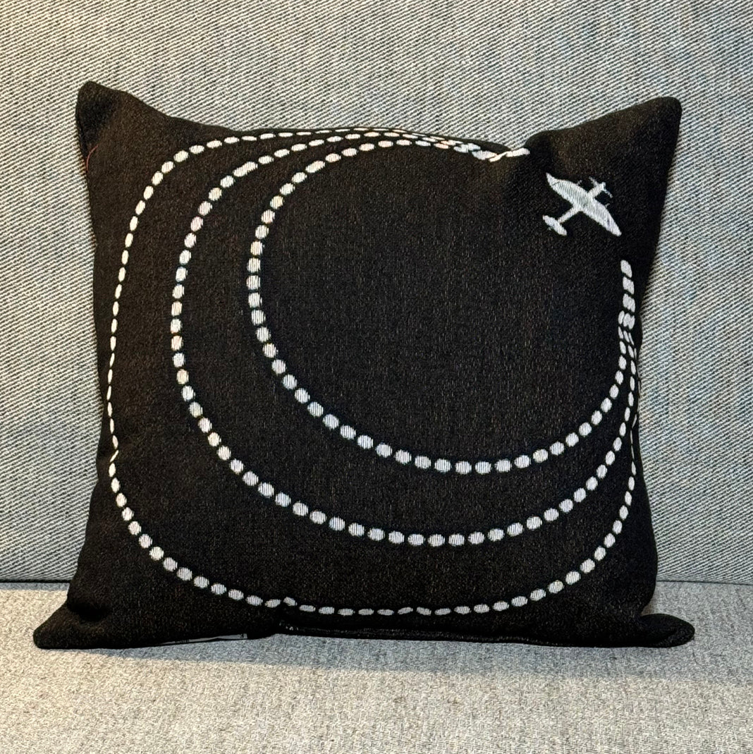 Woven throw pillow circles and plane