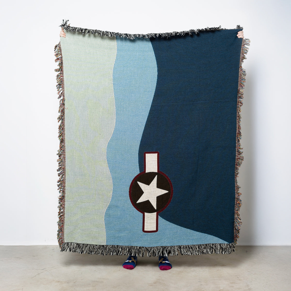 Woven blanket with geometric pattern and star design