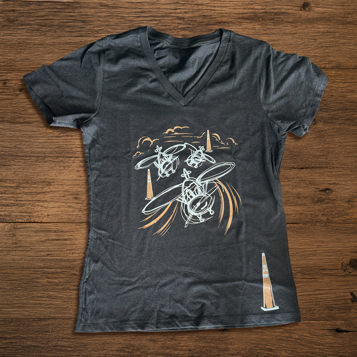 Air racing graphic t-shirt showing three vintage-style sketched airplanes flying around race pylons, perfect for pilots, aircraft builders, and airshow fans