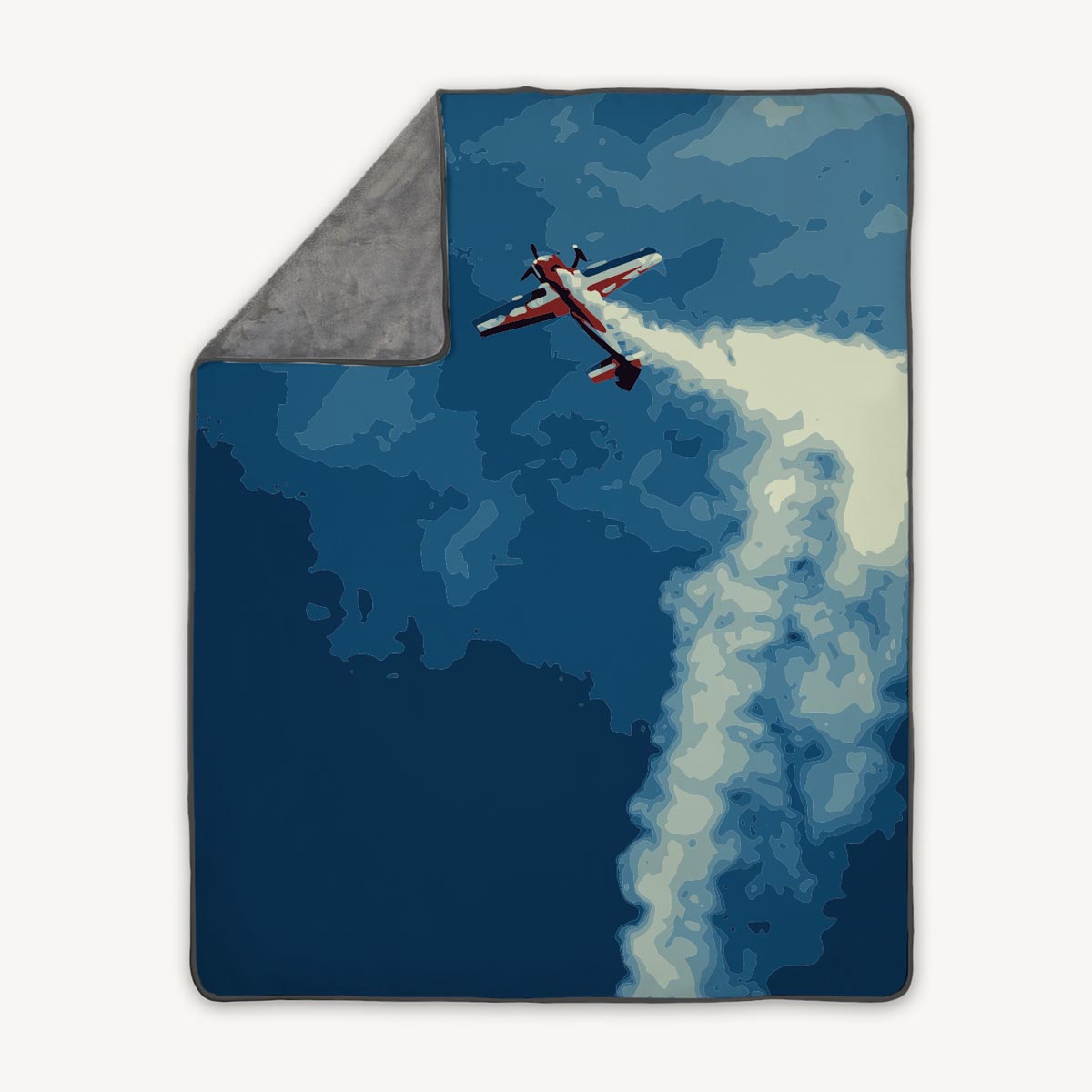 Premium fleece throw blanket with aerobatic airplane in the sky and clouds with smoke trail