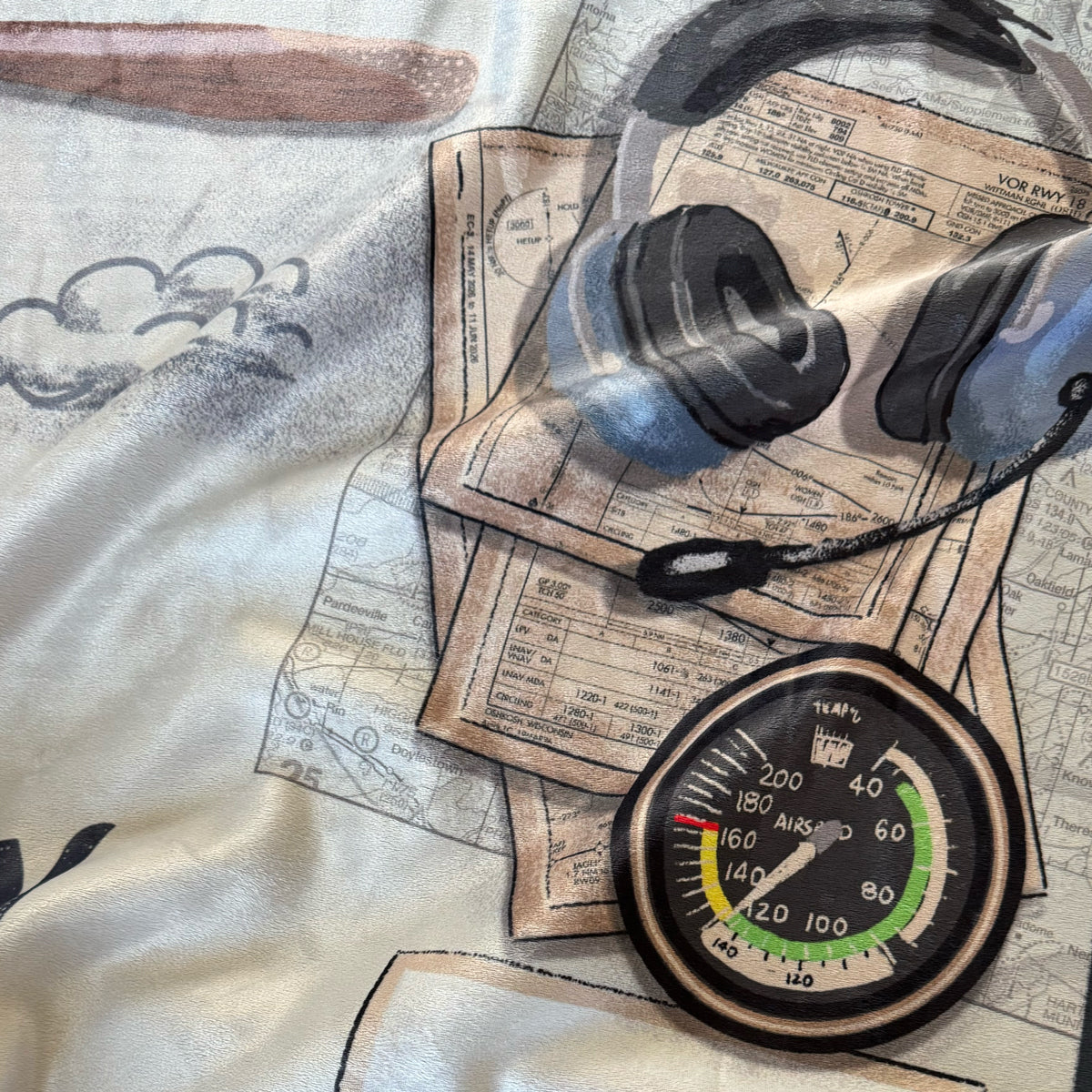Vintage-style airport maps with an altimeter and aviation headset on top