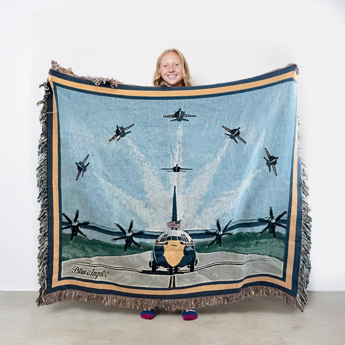 Blue Angels Fat Albert blanket featuring the iconic transport aircraft on the runway beneath six Blue Angels F/A-18 Super Hornets in flight formation.