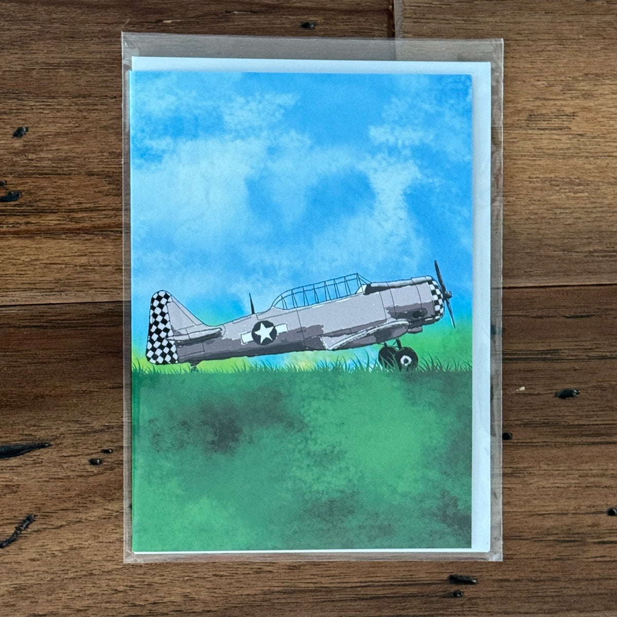 Greeting card with a WWII T-6 Texan airplane paint illustrated on front.