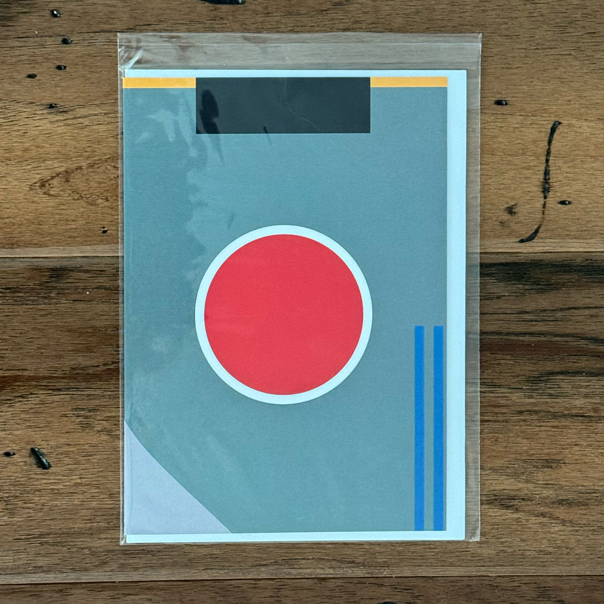 Greeting card with a WWII Japanese Zero airplane paint scheme design on front.