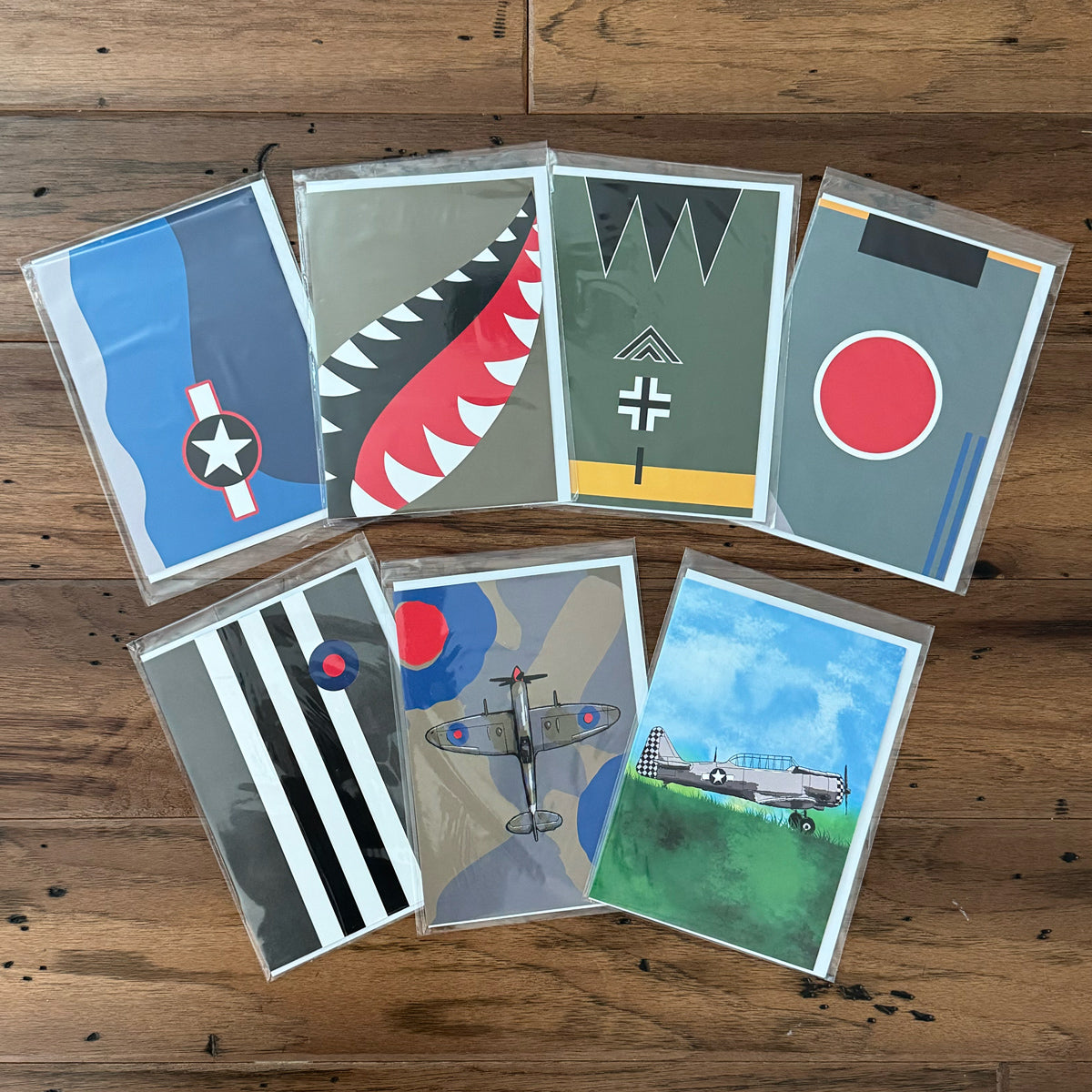 Collection of WWII airplane greeting cards featuring a corsair, P-40, T-6 Texan, Spitfire and more.