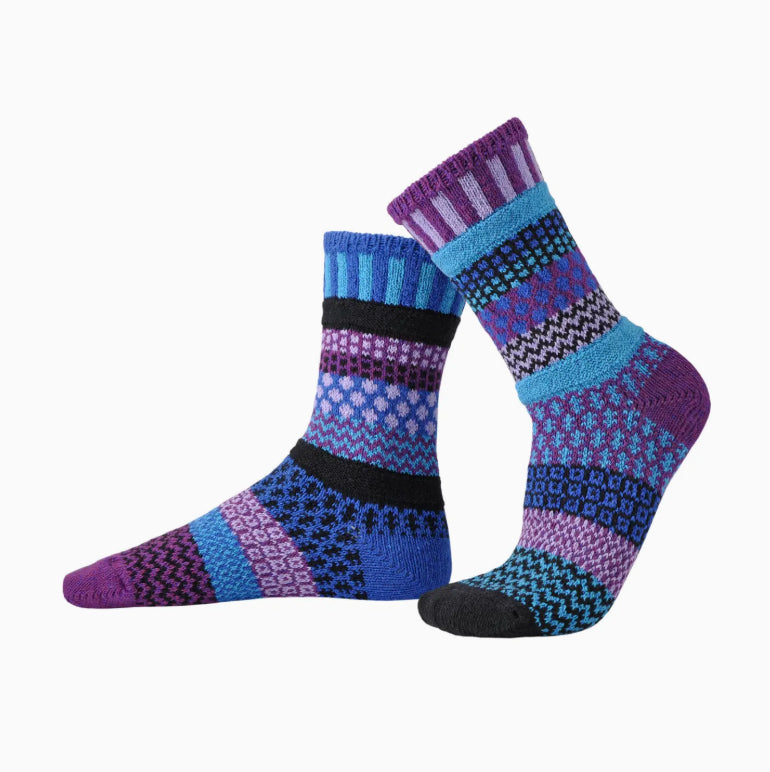 Pair of patterned socks with purple and blue design on a white background
