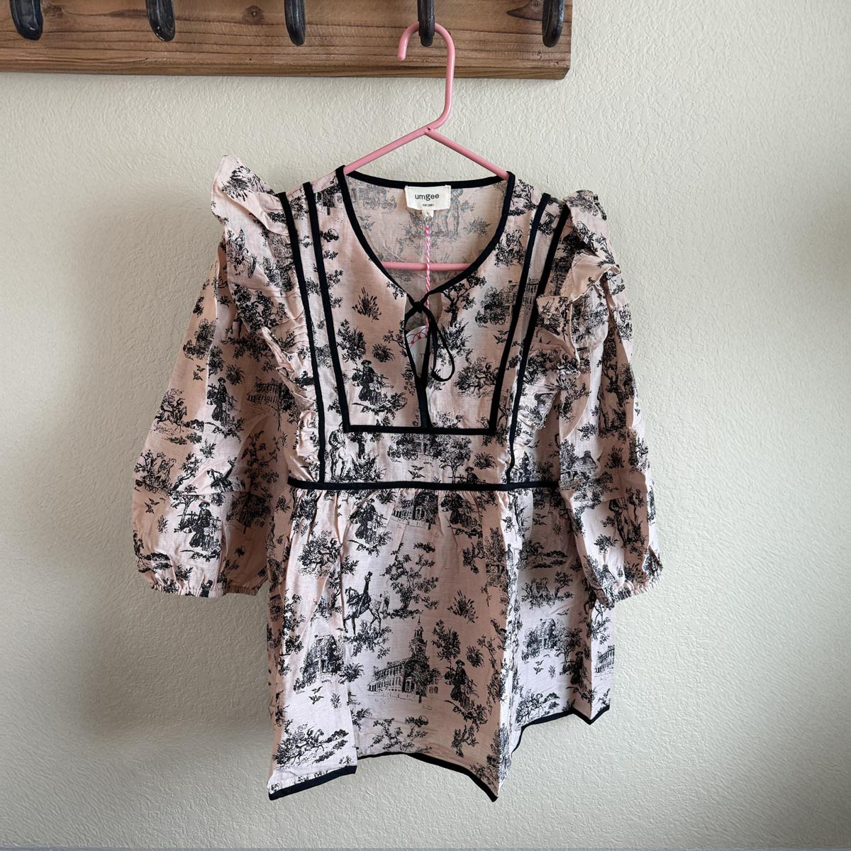 Umgee feminine babydoll top with v-neck in tan and black