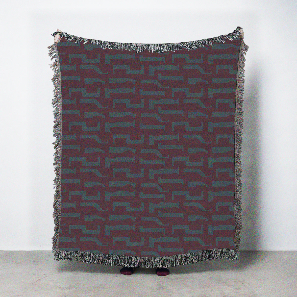 Patterned throw blanket with bucking bars