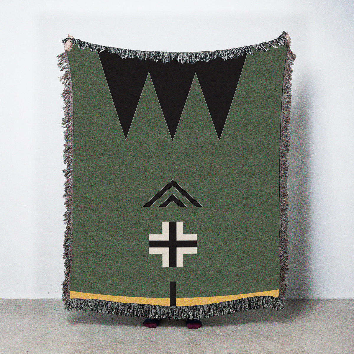 Green blanket with geometric patterns
