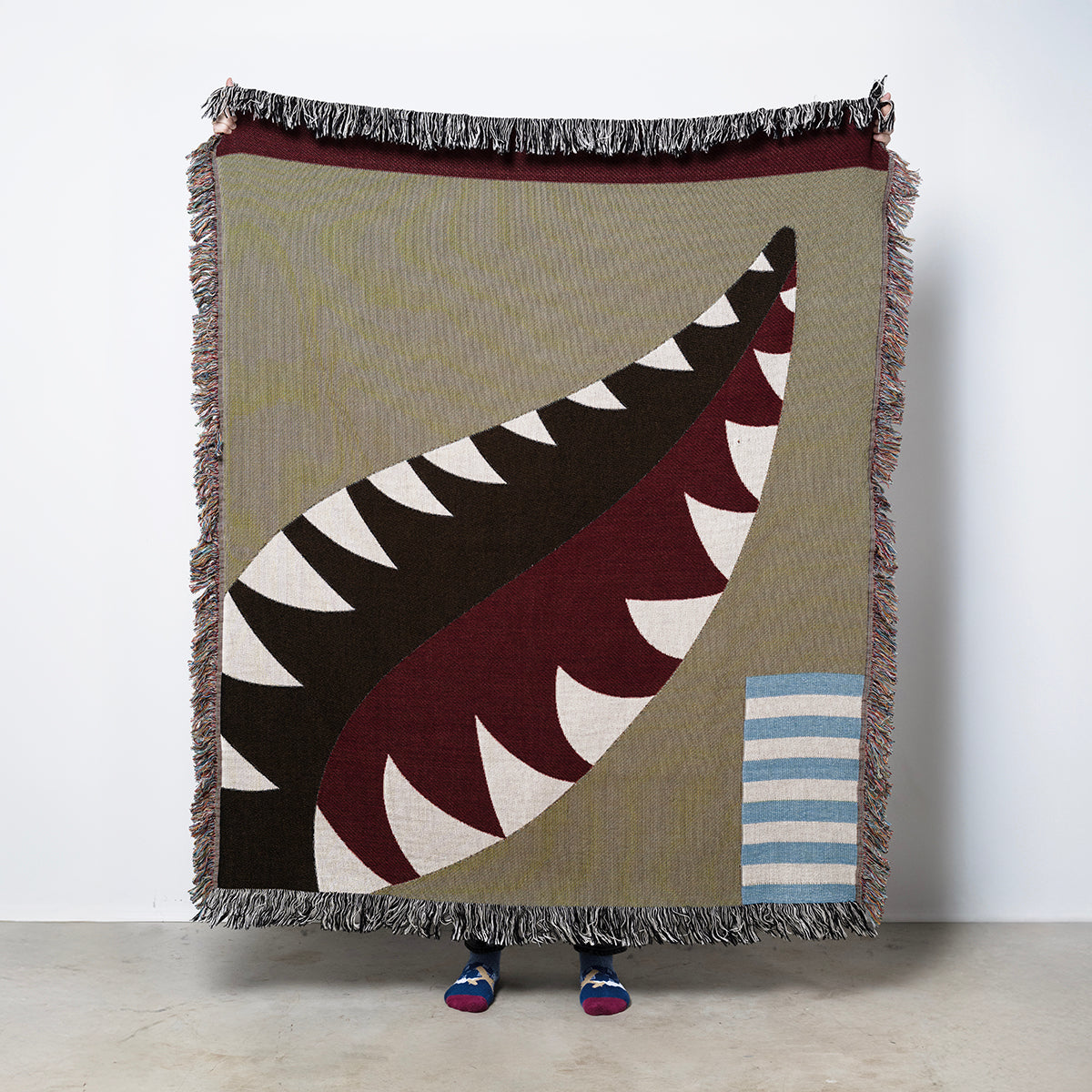 Woven blanket with P-40 shark mouth paint scheme