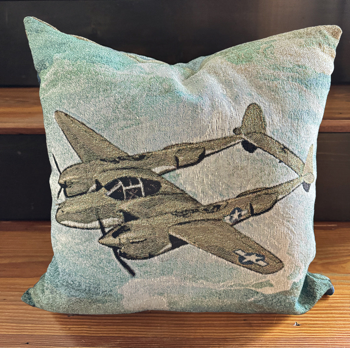 Decorative pillow with vintage illustrated P-38 Lightning airplane