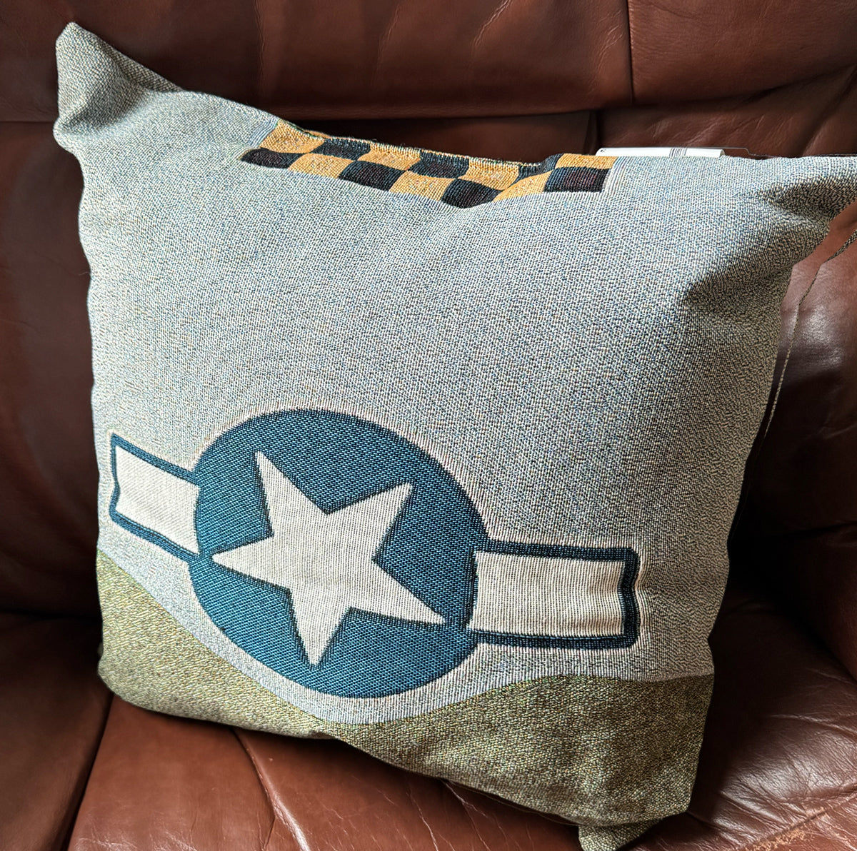 Bottom side of P-51 Mustang woven pillow with star emblem